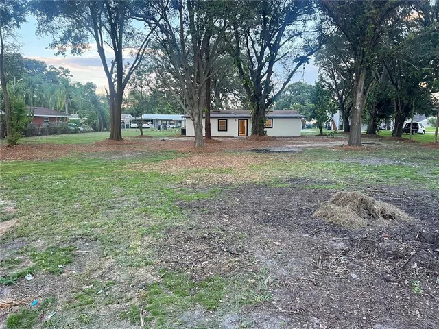 a view of outdoor space with deck and tree