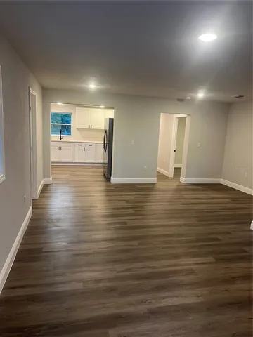 a view of a livingroom with wooden floor