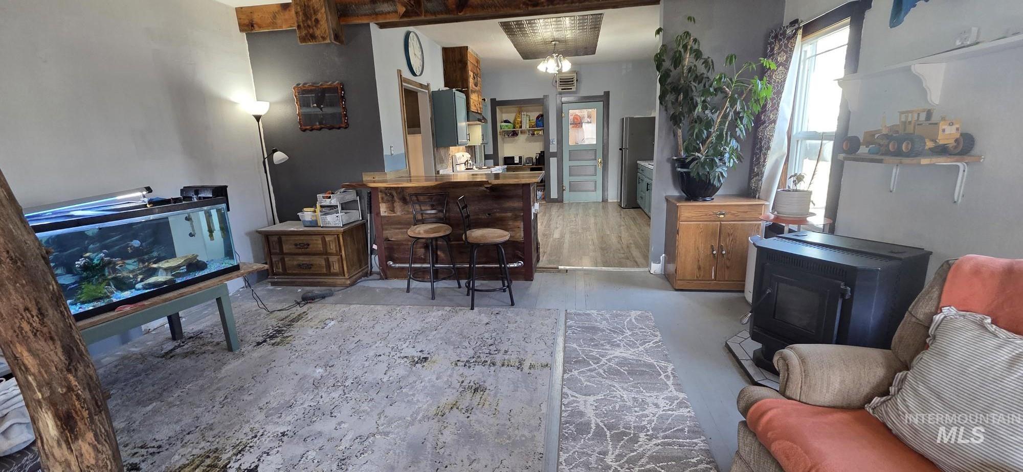 1673 Main Street Pomeroy, WA 99347 - Photo 26 of 26 Kitchen featuring a kitchen breakfast bar, freestanding refrigerator, butcher block countertops, a peninsula, and open floor plan