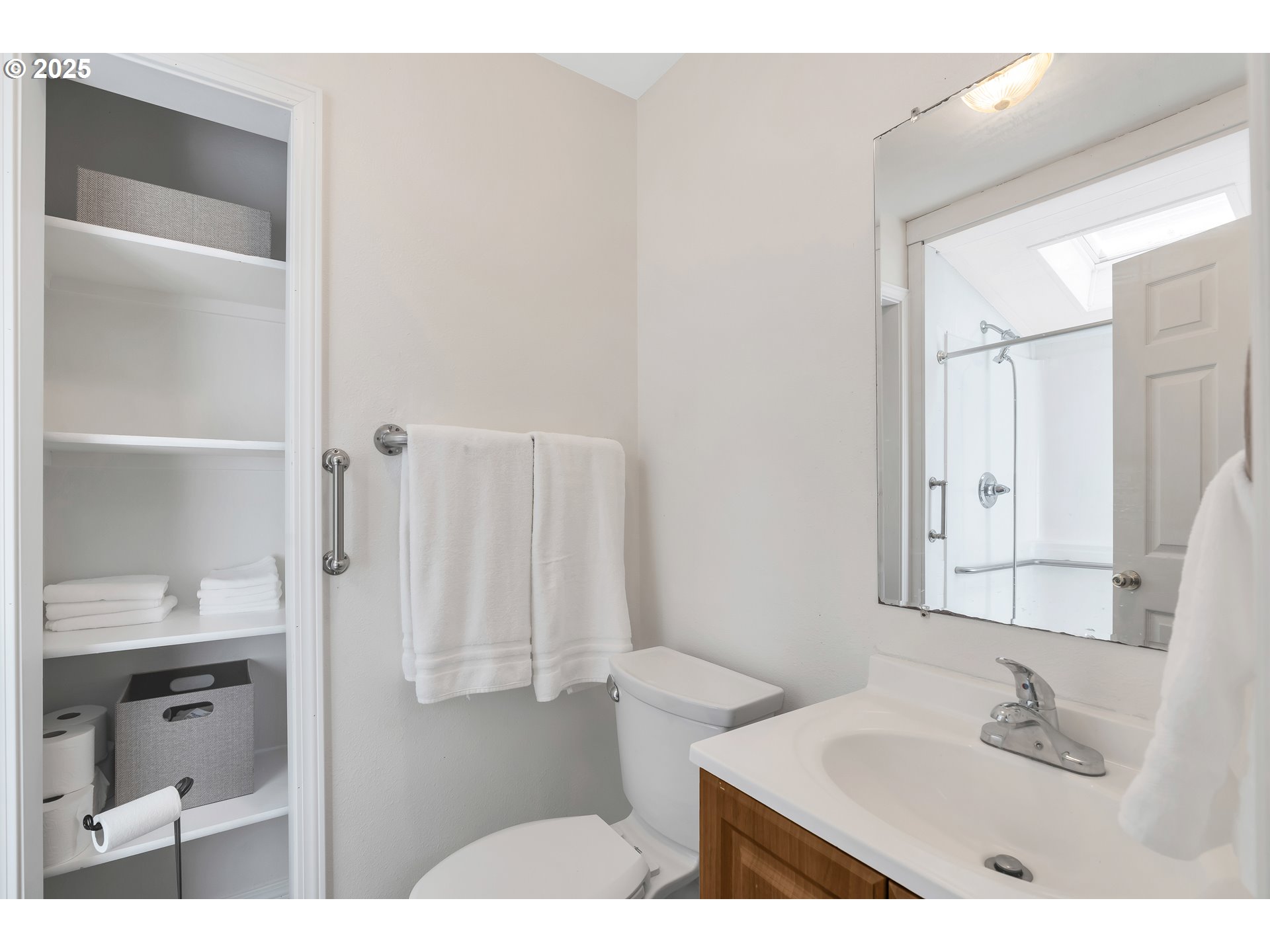 1455 Northeast Jessica Loop Hillsboro, OR 97124 - Photo 13 of 39 a bathroom with a sink and a mirror