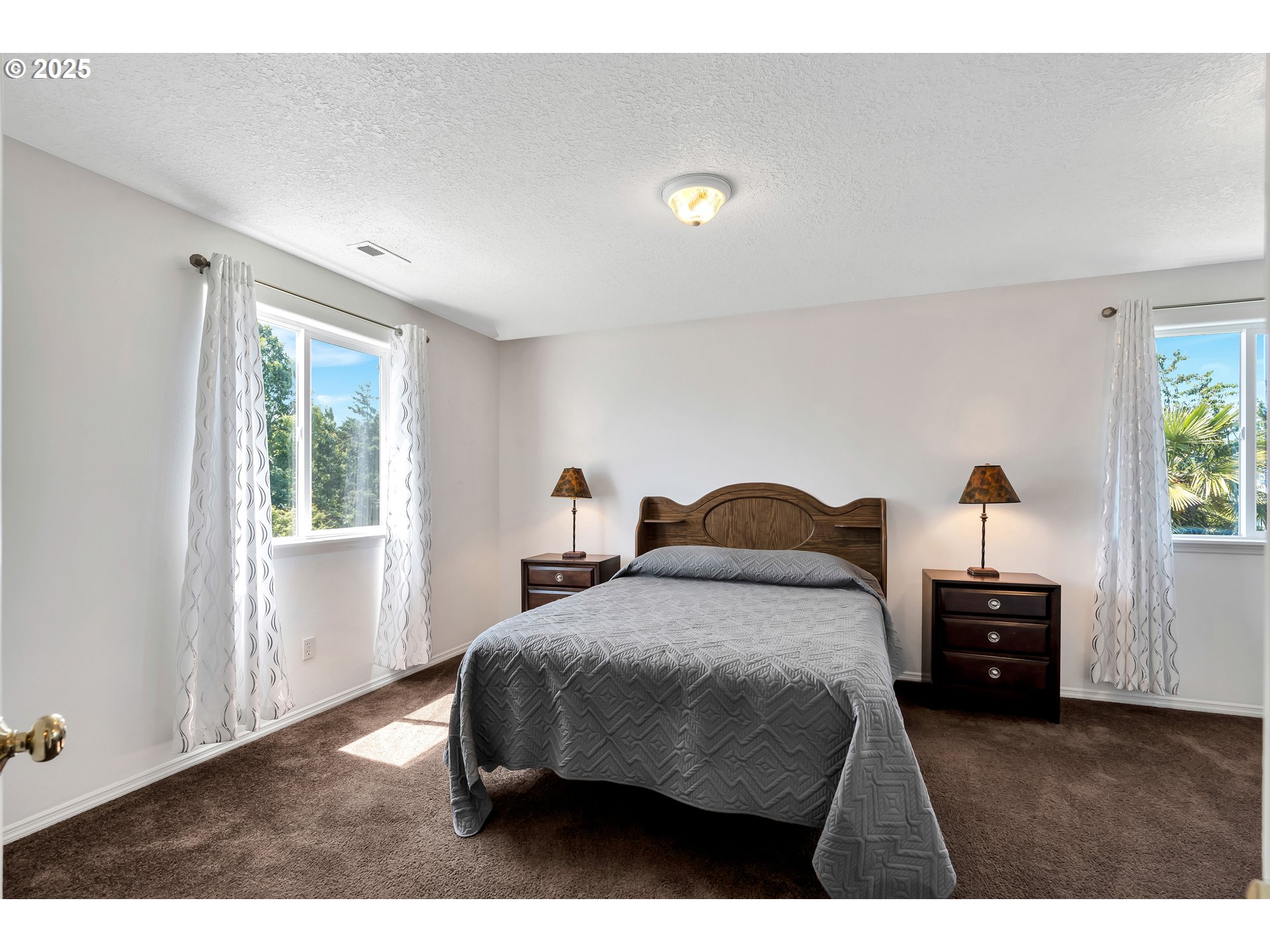 1455 Northeast Jessica Loop Hillsboro, OR 97124 - Photo 24 of 39 a bedroom with a bed and a window