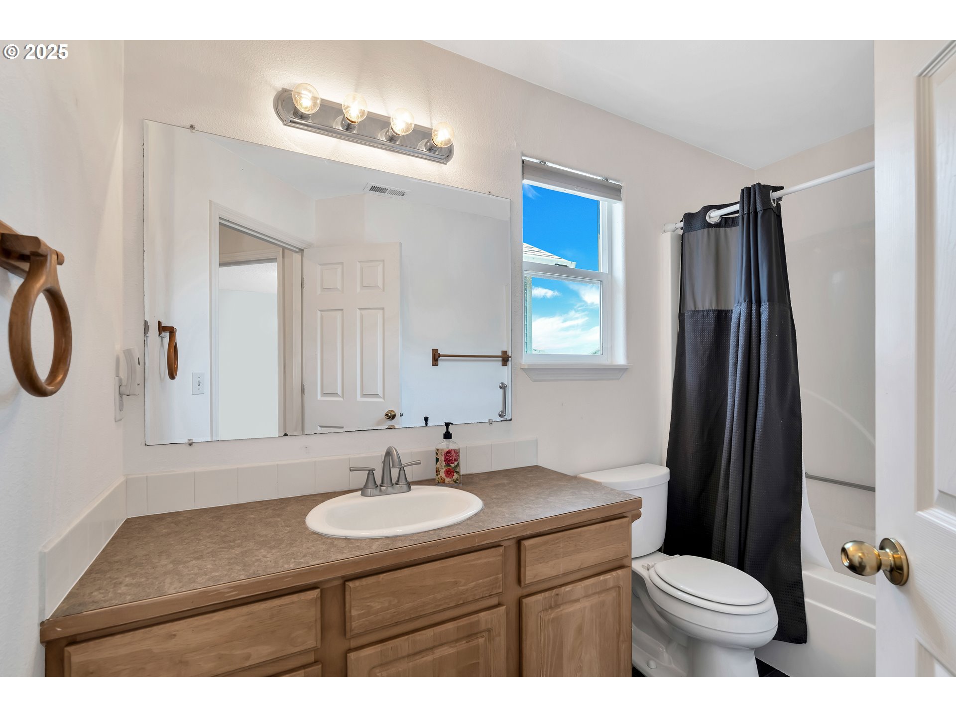 1455 Northeast Jessica Loop Hillsboro, OR 97124 - Photo 27 of 39 a bathroom with a sink toilet and shower