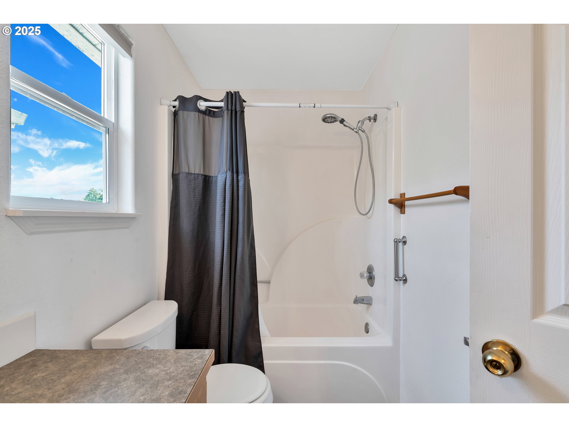 1455 Northeast Jessica Loop Hillsboro, OR 97124 - Photo 28 of 39 a bathroom with a shower and a tub