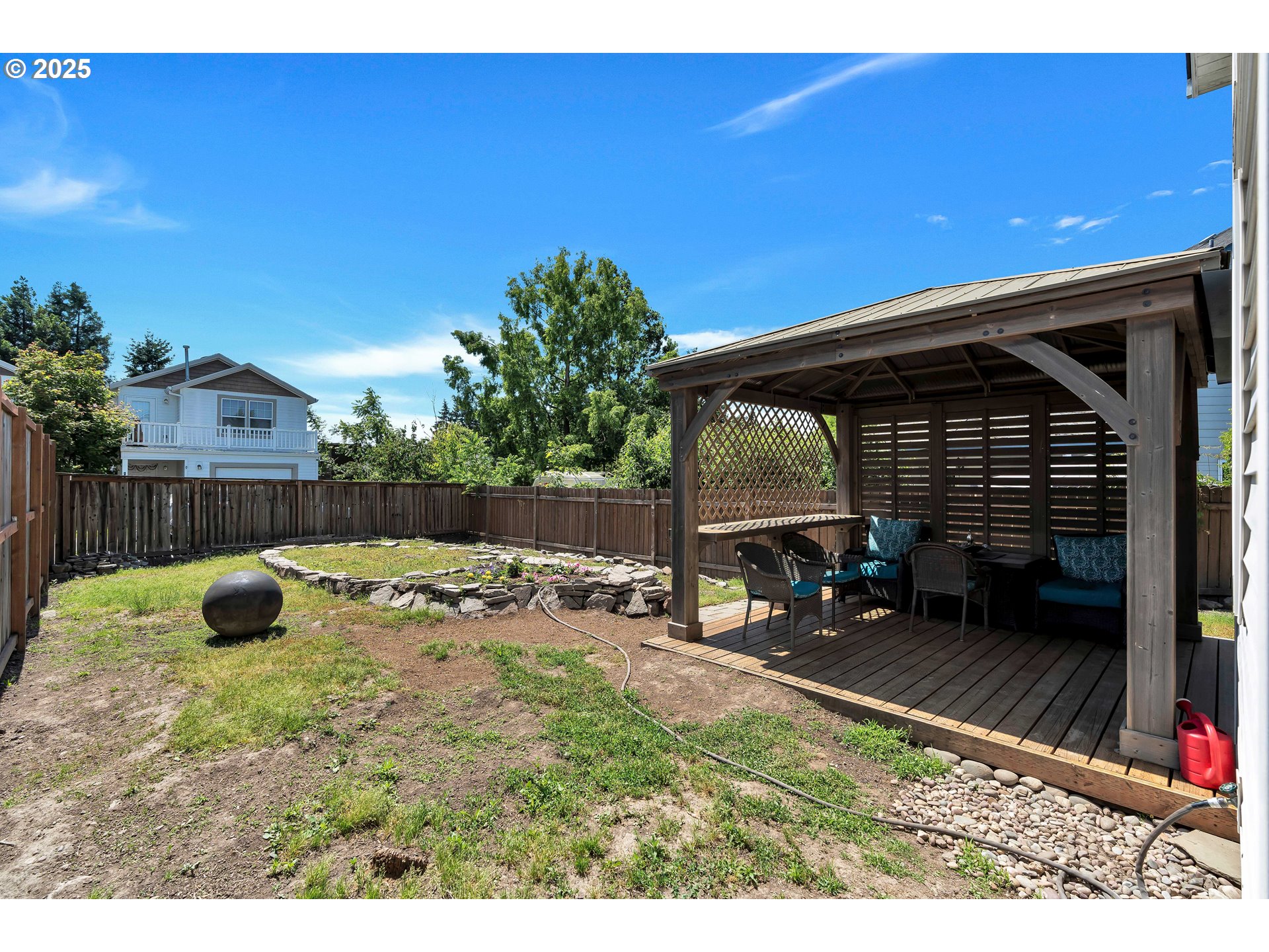1455 Northeast Jessica Loop Hillsboro, OR 97124 - Photo 34 of 39 a backyard of a house with yard and outdoor seating