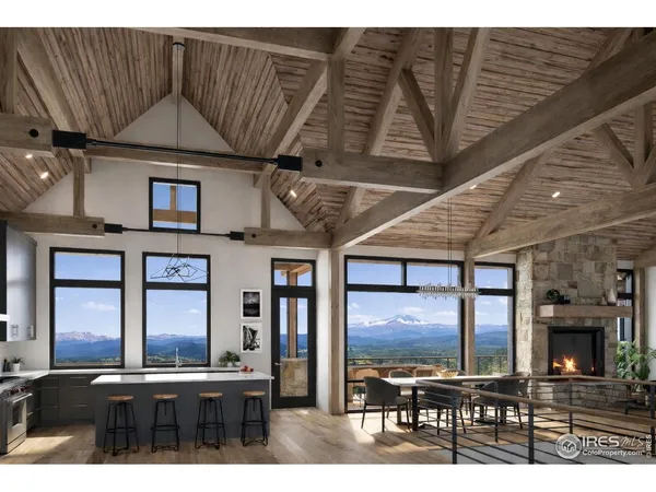 a living room with stainless steel appliances kitchen island granite countertop furniture a fireplace and a flat screen tv