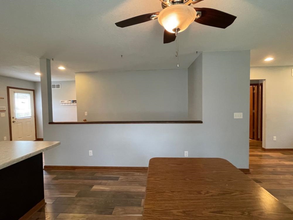 924 8th Avenue Rochelle, IL 61068 - Photo 14 of 66 a view of kitchen and empty room with wooden floor