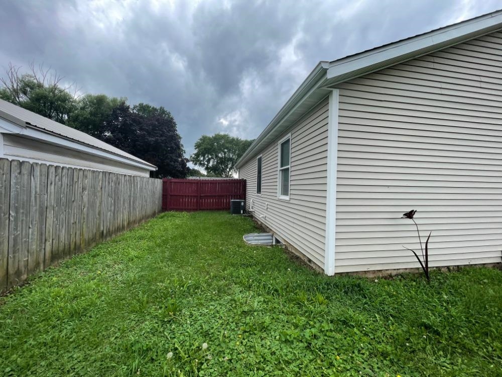 924 8th Avenue Rochelle, IL 61068 - Photo 57 of 66 a view of a backyard with wooden fence