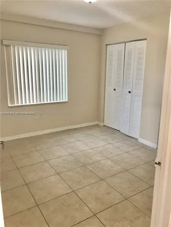 an empty room with entrance door