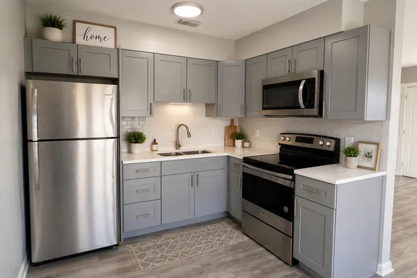 a kitchen with a refrigerator stove and microwave