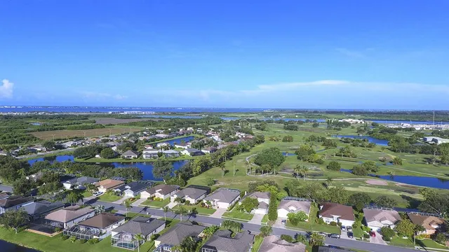 an aerial view of a house with a lake view