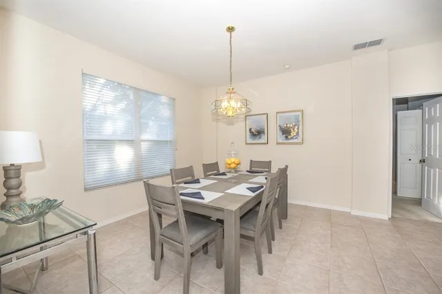 a bedroom with a bed and a refrigerator