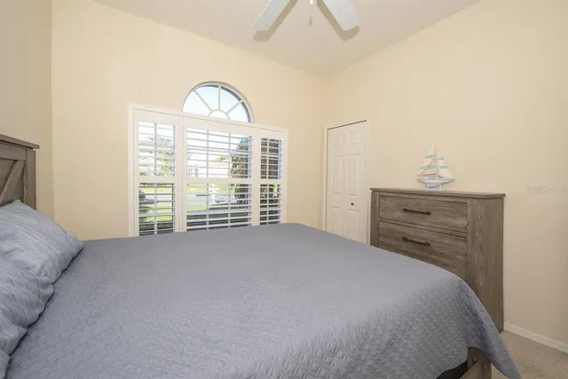 a bathroom with a sink toilet a mirror and shower