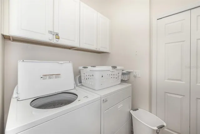 a view of a swimming pool with a fountain in front of it