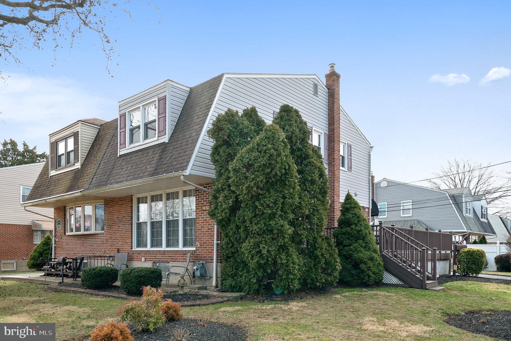 1432 Parklane Road Swarthmore, PA 19081 - Photo 1 of 19 a view of a building with a yard and plants