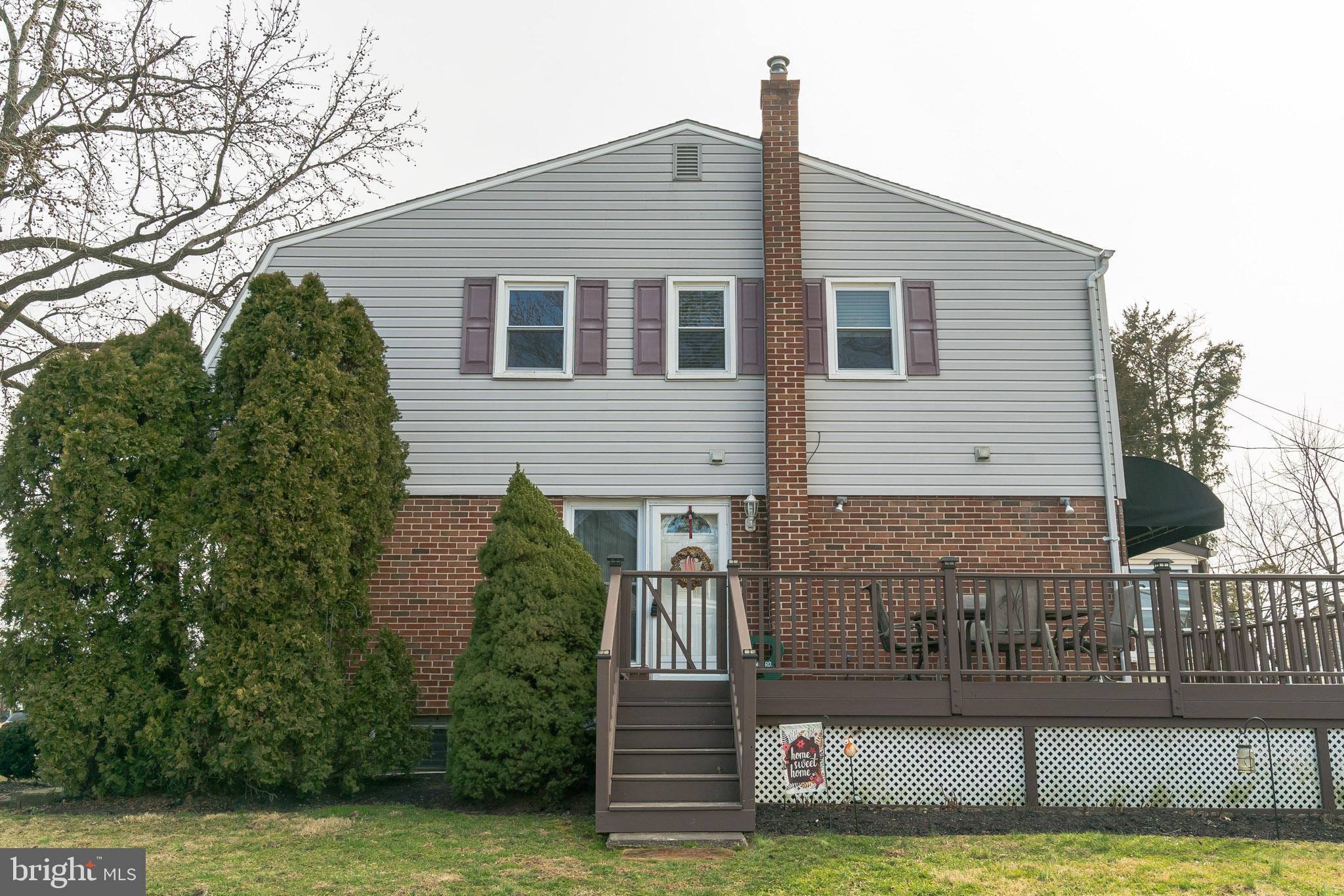 1432 Parklane Road Swarthmore, PA 19081 - Photo 2 of 19 a view of a house with a small yard and plants