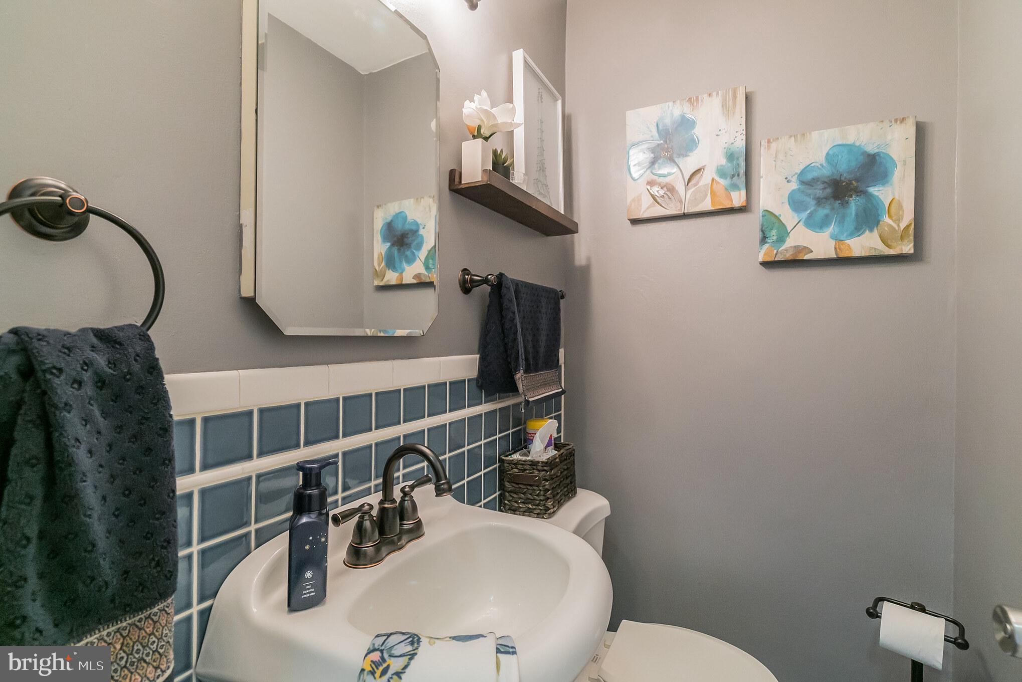 1432 Parklane Road Swarthmore, PA 19081 - Photo 13 of 19 a bathroom with a sink mirror and vanity