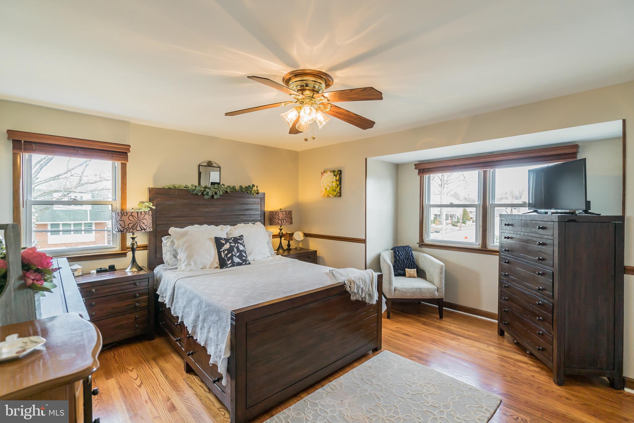 1432 Parklane Road Swarthmore, PA 19081 - Photo 14 of 19 a bedroom with a bed and wooden floor