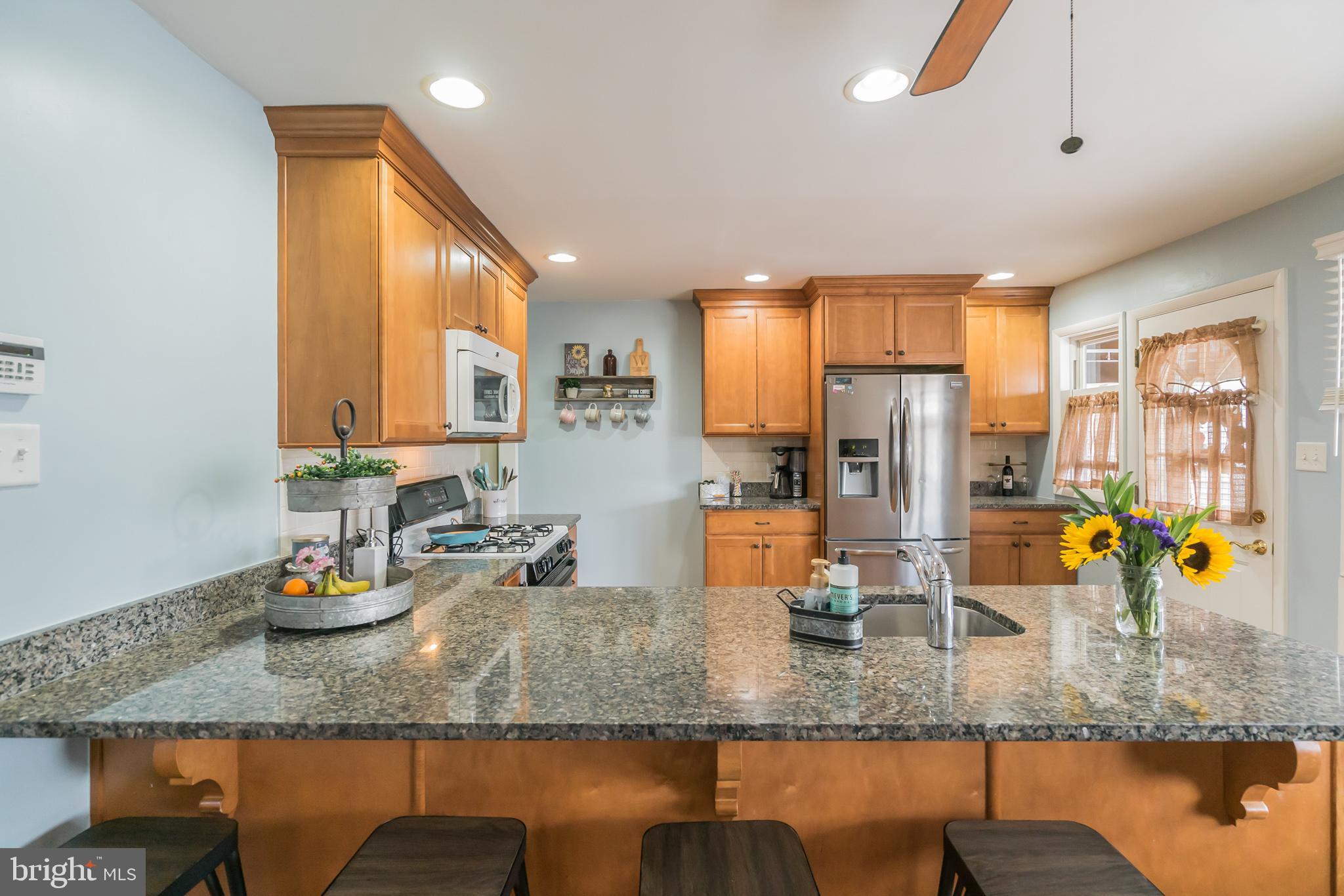 1432 Parklane Road Swarthmore, PA 19081 - Photo 10 of 19 a kitchen with stainless steel appliances granite countertop a sink counter space and a window