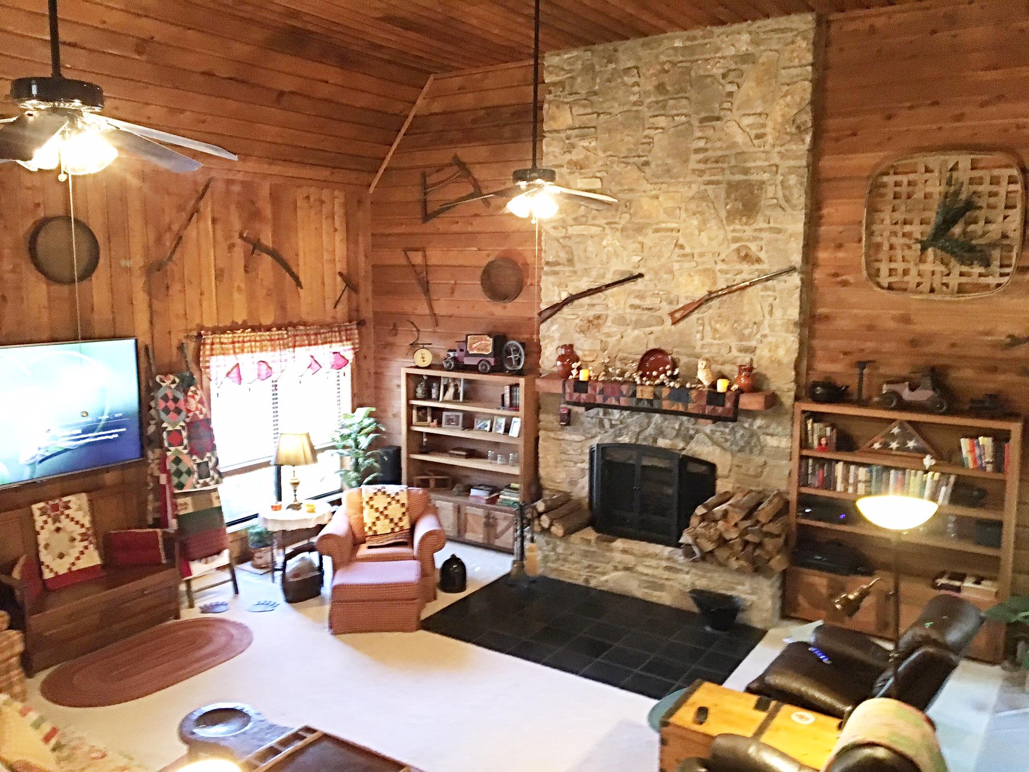 a living room with furniture and a fireplace