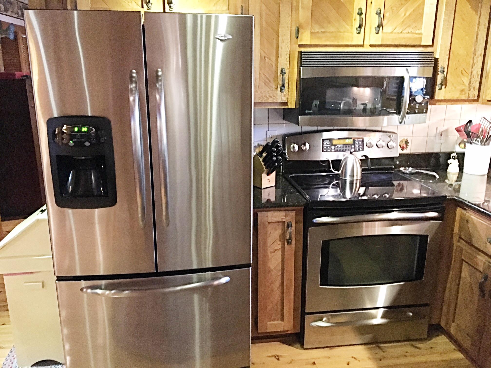 2731 New Hall Road Greenbrier, TN 37073 - Photo 15 of 30 a kitchen with stainless steel appliances granite countertop a refrigerator and a stove