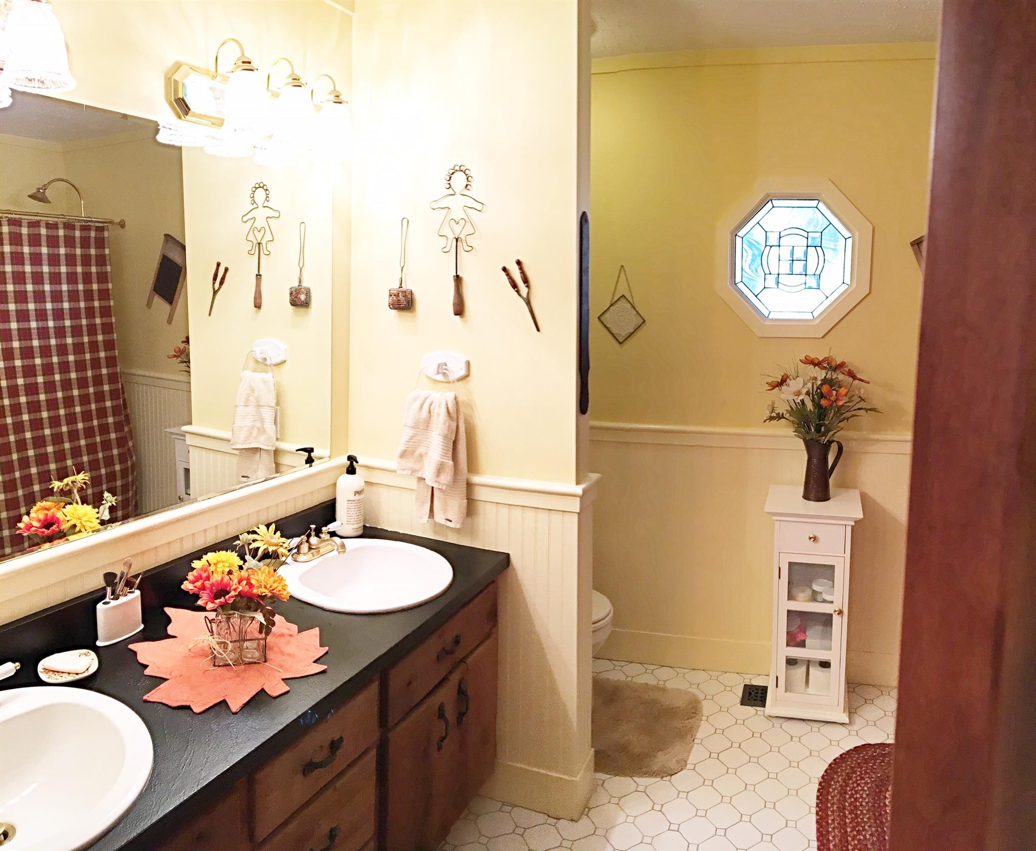 2731 New Hall Road Greenbrier, TN 37073 - Photo 25 of 30 a bathroom with a sink mirror and vanity