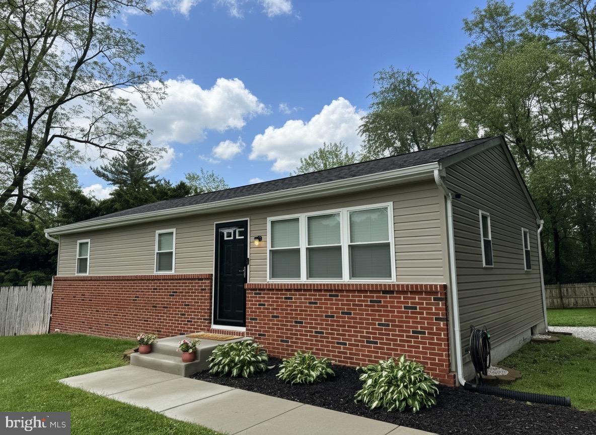 370 Big Elk Chapel Road Elkton, MD 21921 - Photo 1 of 29 a front view of a house with garden
