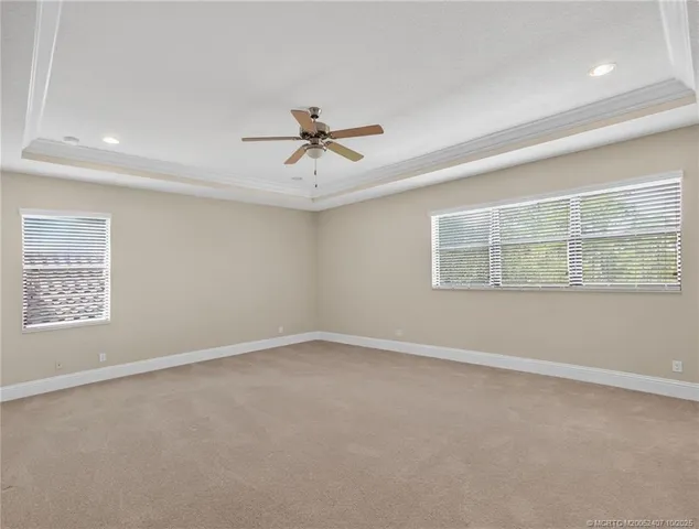 a spacious bathroom with a tub sink and mirror