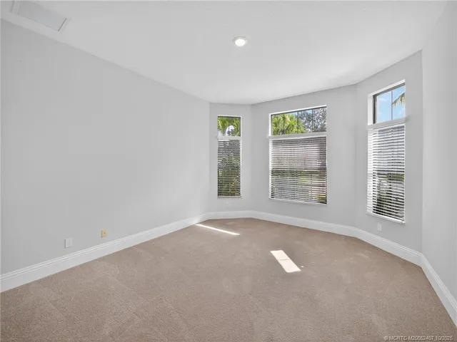 a bathroom with a granite countertop sink toilet a large mirror and shower