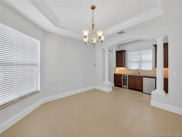a large kitchen with a lot of cabinets and stainless steel appliances