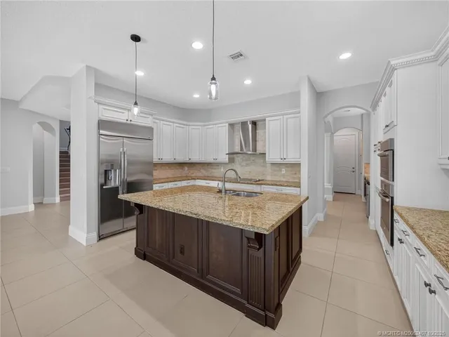 a view of an empty room with closet and a window