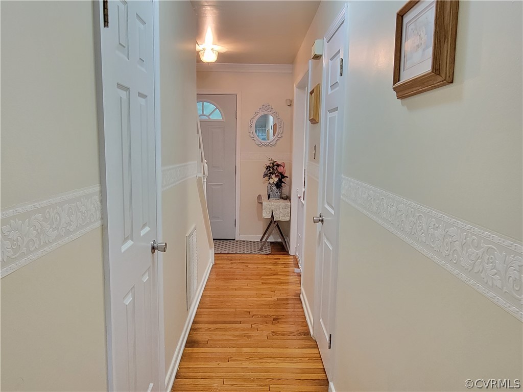 5814 Laurel Trail Road Midlothian, VA 23112 - Photo 14 of 34 a view of a hallway with wooden floor and staircase