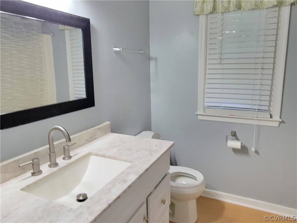 5814 Laurel Trail Road Midlothian, VA 23112 - Photo 19 of 34 a bathroom with a toilet sink and mirror