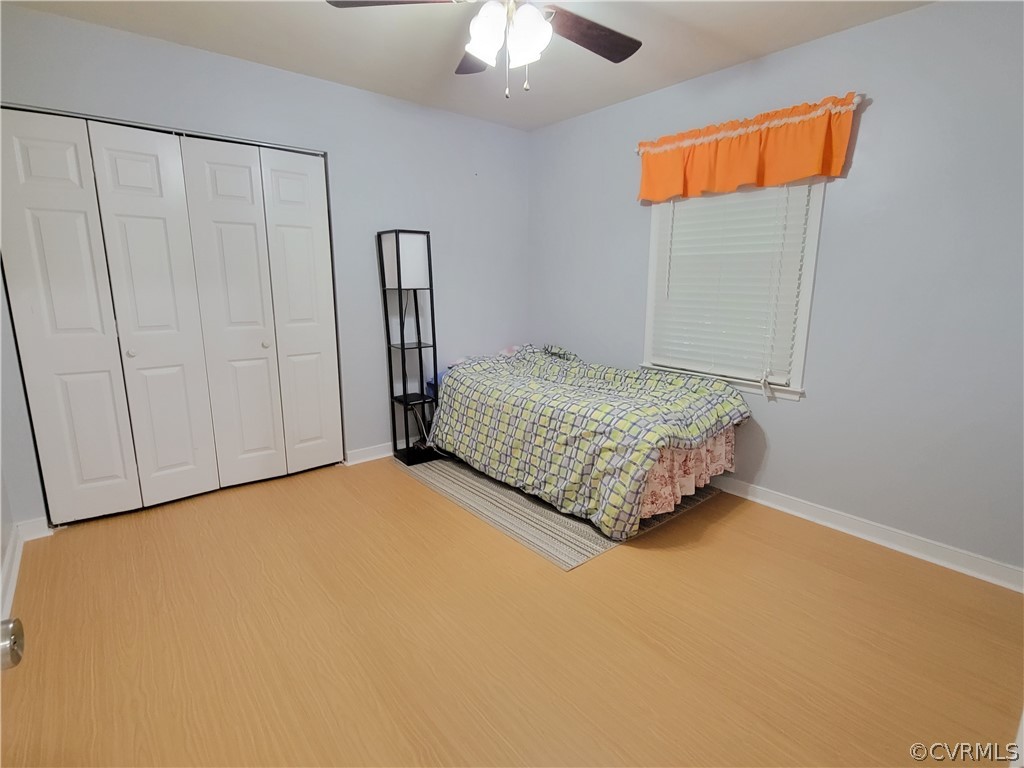 5814 Laurel Trail Road Midlothian, VA 23112 - Photo 23 of 34 a room with a bed and a chandelier