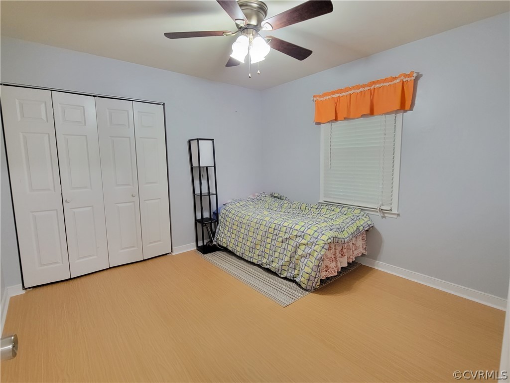 5814 Laurel Trail Road Midlothian, VA 23112 - Photo 24 of 34 a bedroom with a bed and a ceiling fan