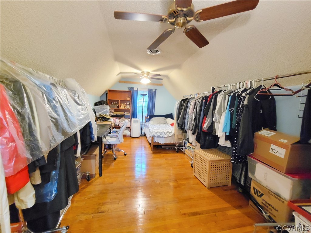 5814 Laurel Trail Road Midlothian, VA 23112 - Photo 30 of 34 a living room with lots of clothes and shoes