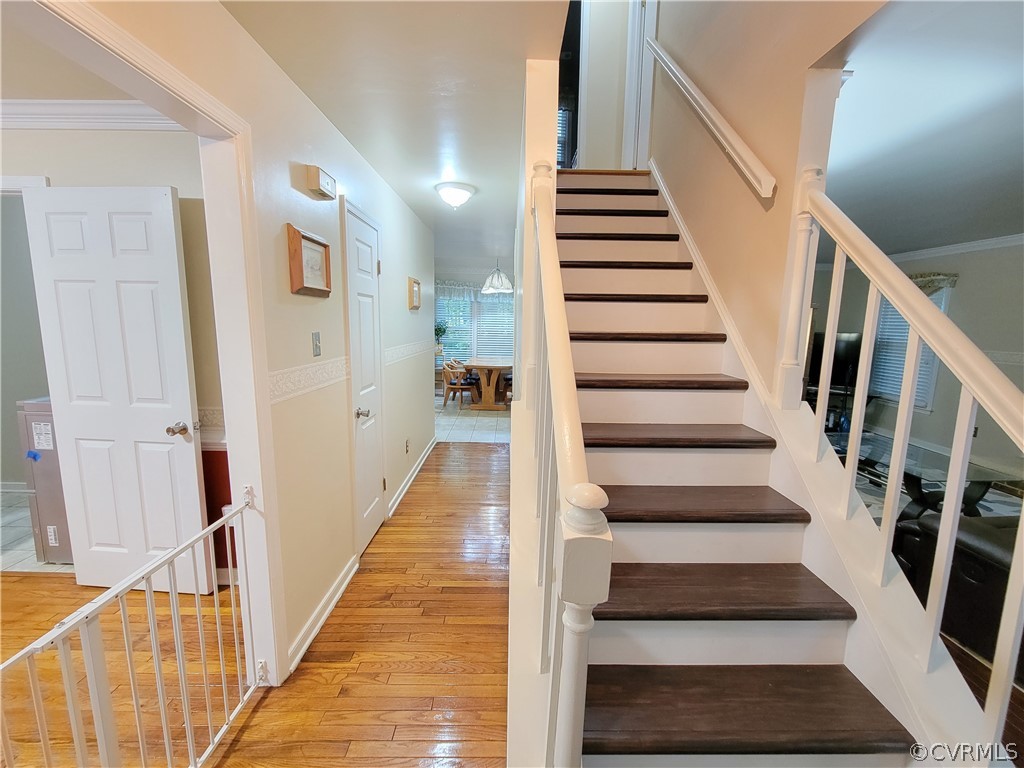 5814 Laurel Trail Road Midlothian, VA 23112 - Photo 5 of 34 a view of staircase with wooden floor and white walls