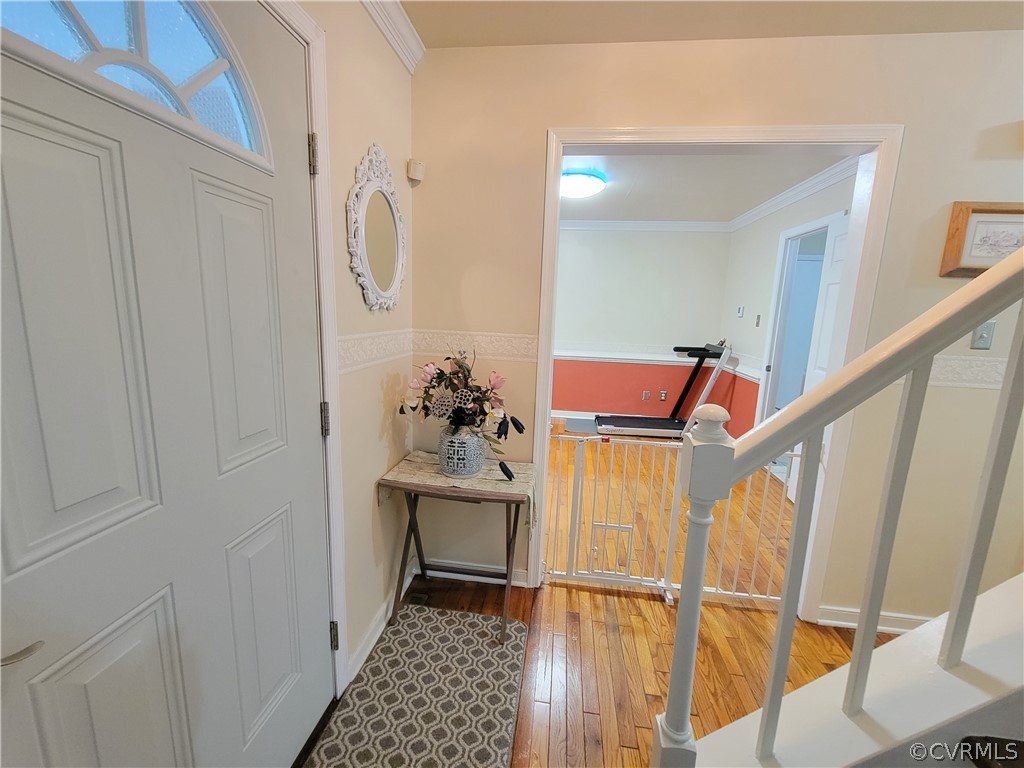 5814 Laurel Trail Road Midlothian, VA 23112 - Photo 7 of 34 a view of a hallway with wooden floor and staircase