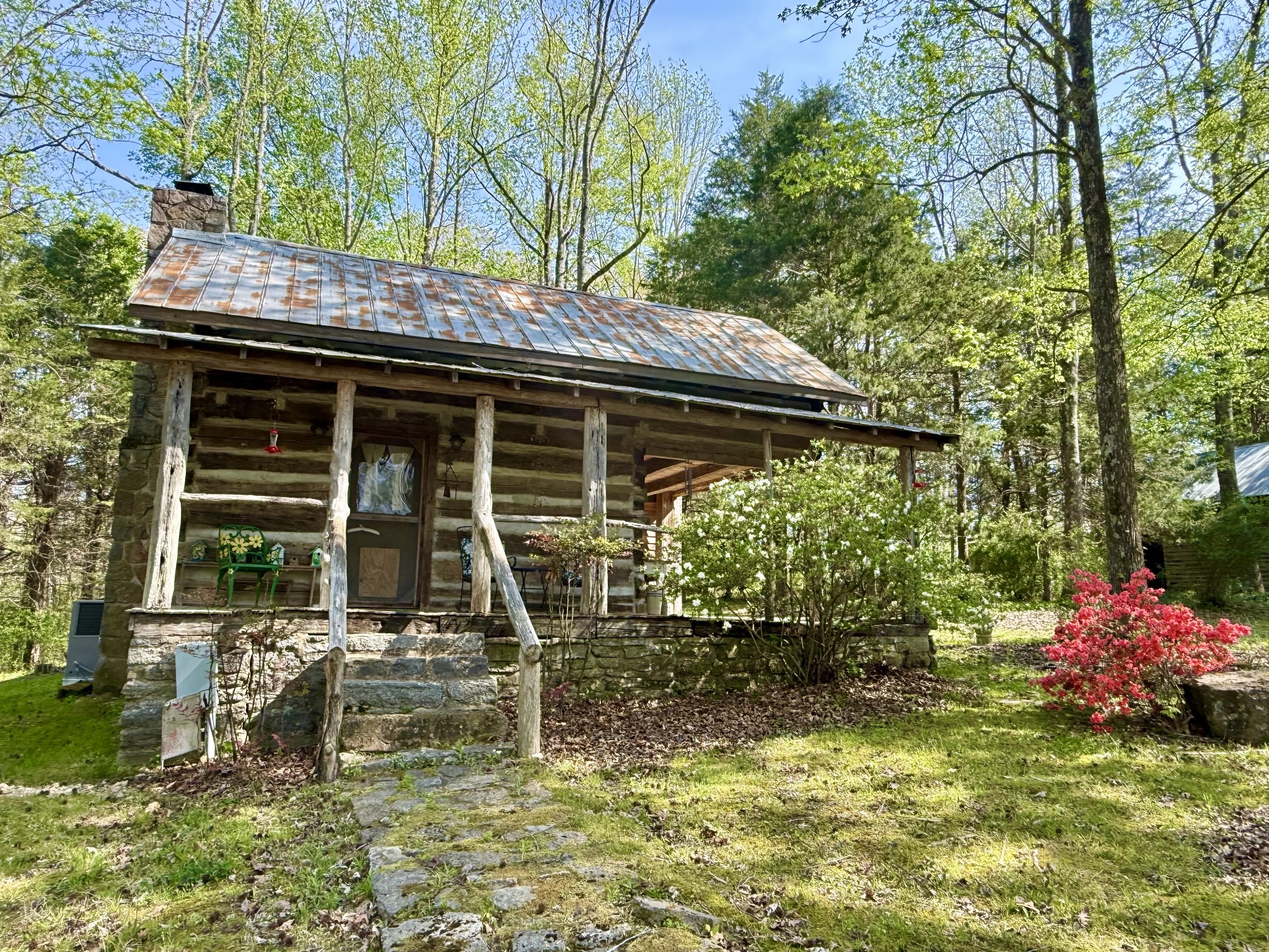 562 Junus Jackson Hollow Road Minor Hill, TN 38473 - Photo 1 of 72 a backyard of a house with table and chairs