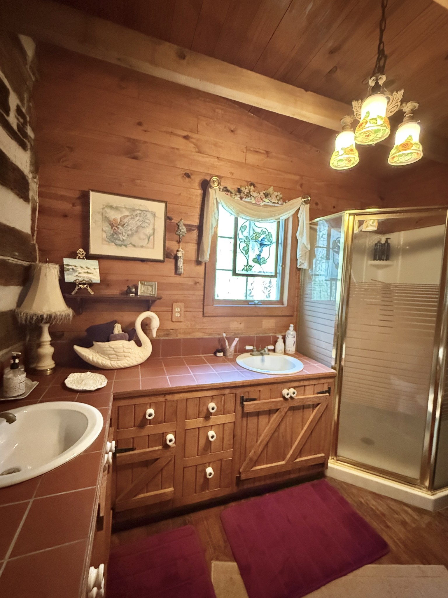 562 Junus Jackson Hollow Road Minor Hill, TN 38473 - Photo 50 of 72 a bathroom with a sink a mirror and a shower