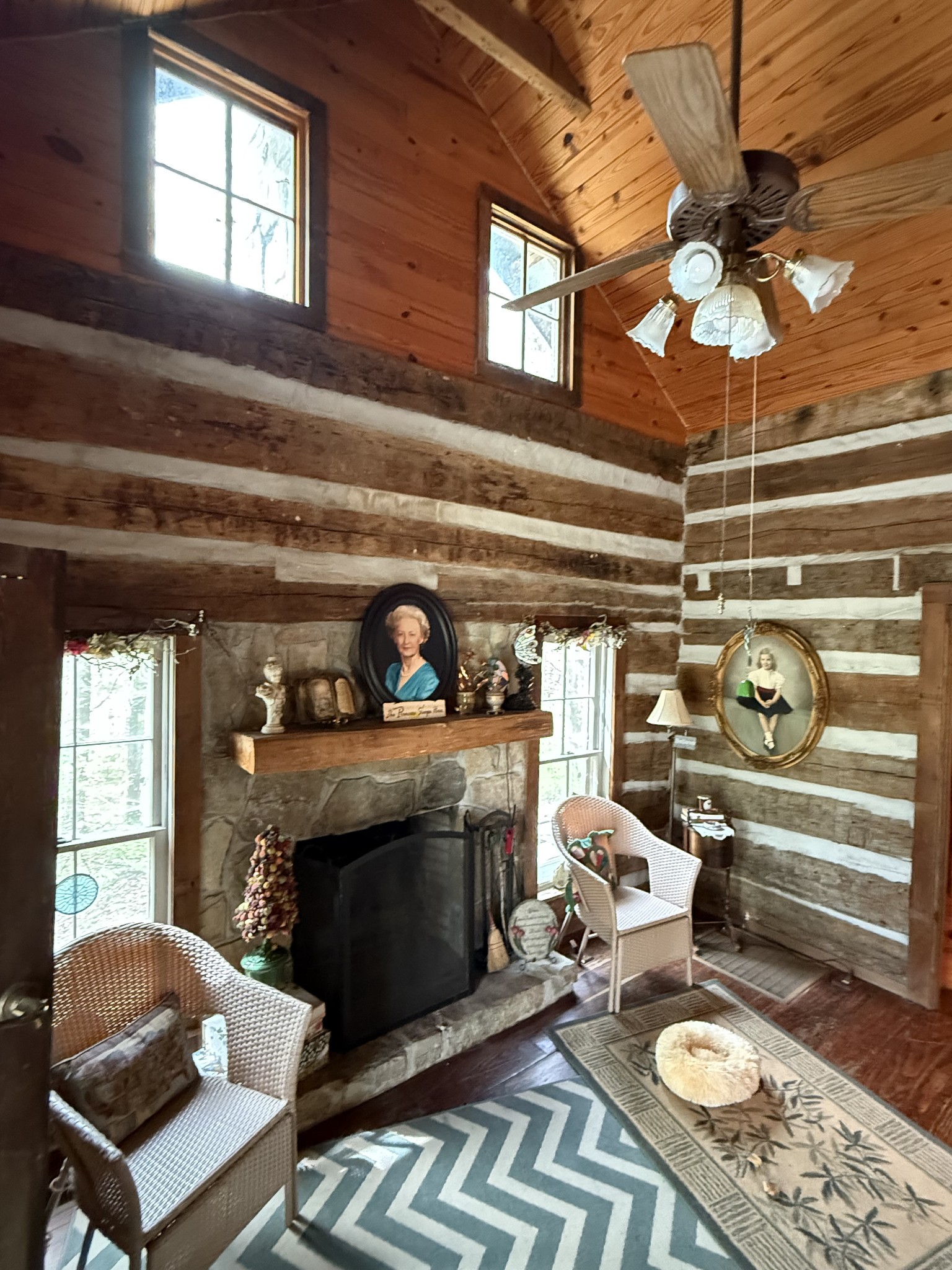562 Junus Jackson Hollow Road Minor Hill, TN 38473 - Photo 58 of 72 a living room with furniture a fireplace and a chandelier