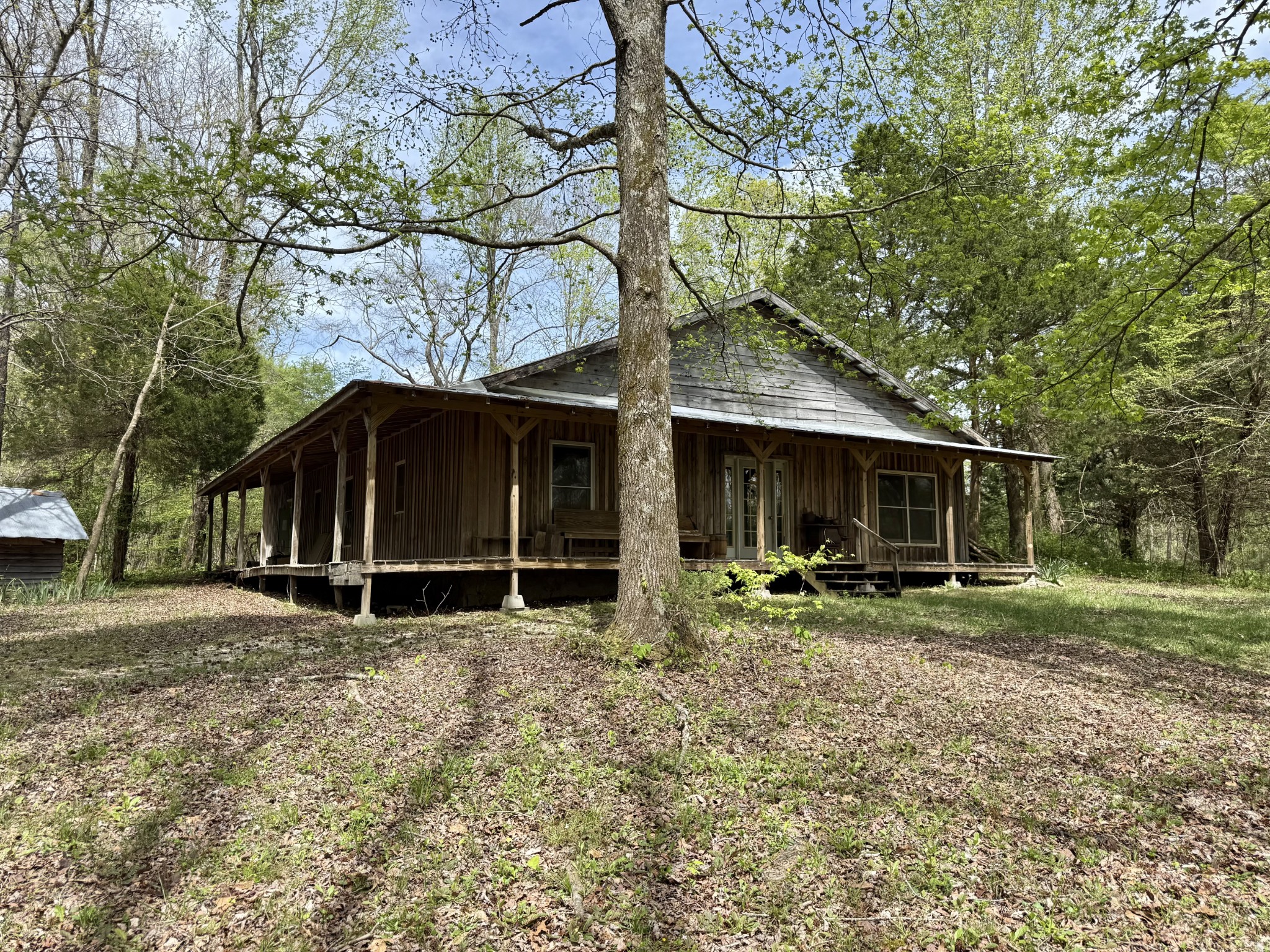 562 Junus Jackson Hollow Road Minor Hill, TN 38473 - Photo 70 of 72 a view of a house with backyard and trees