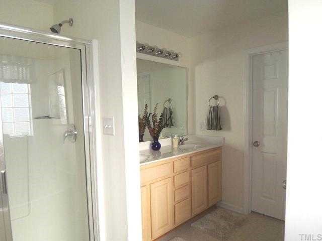 6028 Brambleberry Way Raleigh, NC 27616 - Photo 6 of 12 Master Bath features his and her sinks, separate shower and tub.