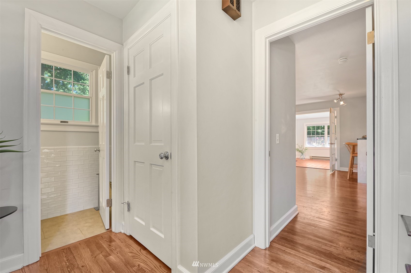 622 Everglade Road Bellingham, WA 98225 - Photo 16 of 38 a view of a hallway with wooden floor and a bathroom