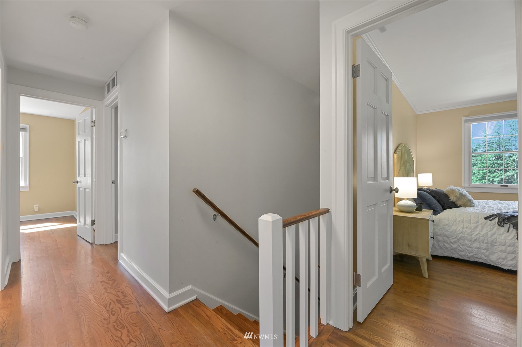 622 Everglade Road Bellingham, WA 98225 - Photo 21 of 38 a view of a bedroom with wooden floor and windows