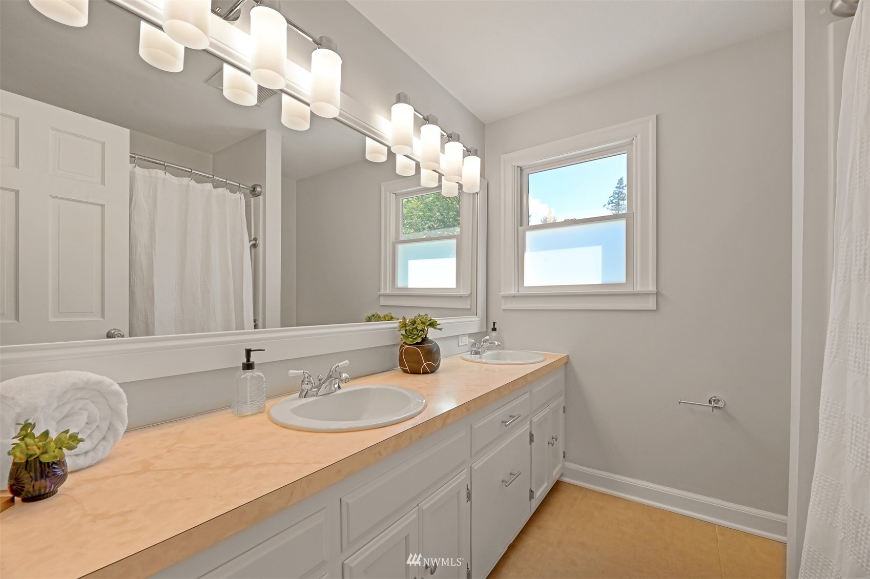 622 Everglade Road Bellingham, WA 98225 - Photo 22 of 38 a bathroom with a sink a vanity and a mirror