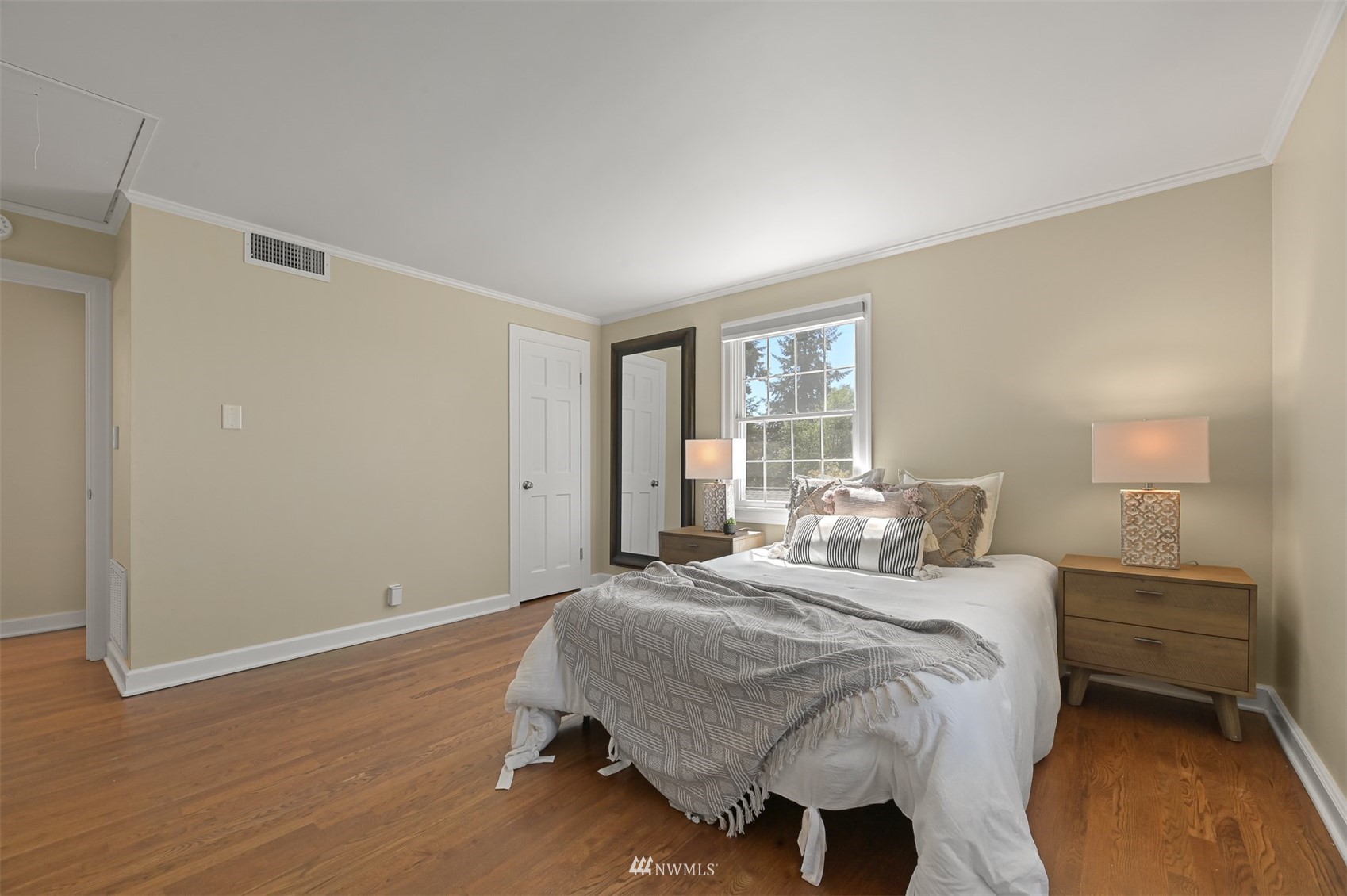 622 Everglade Road Bellingham, WA 98225 - Photo 25 of 38 a bedroom with a bed a table and painting