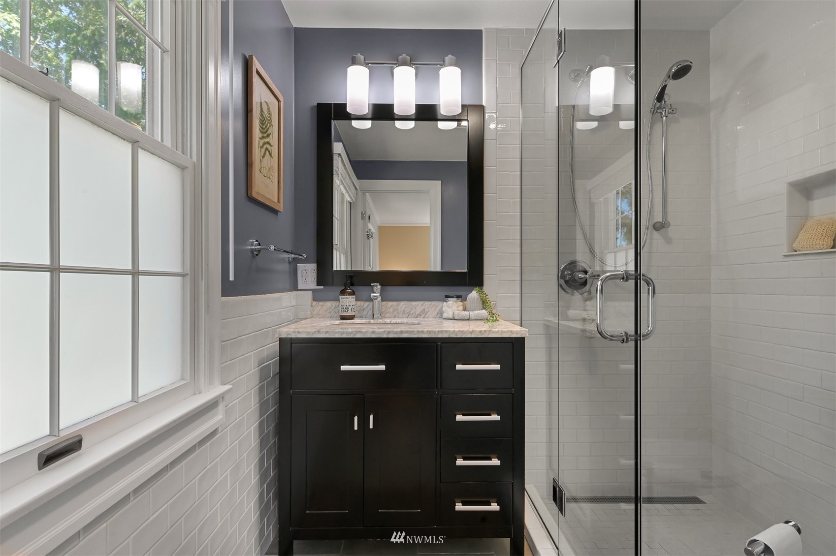 622 Everglade Road Bellingham, WA 98225 - Photo 26 of 38 a bathroom with a double vanity sink mirror and shower