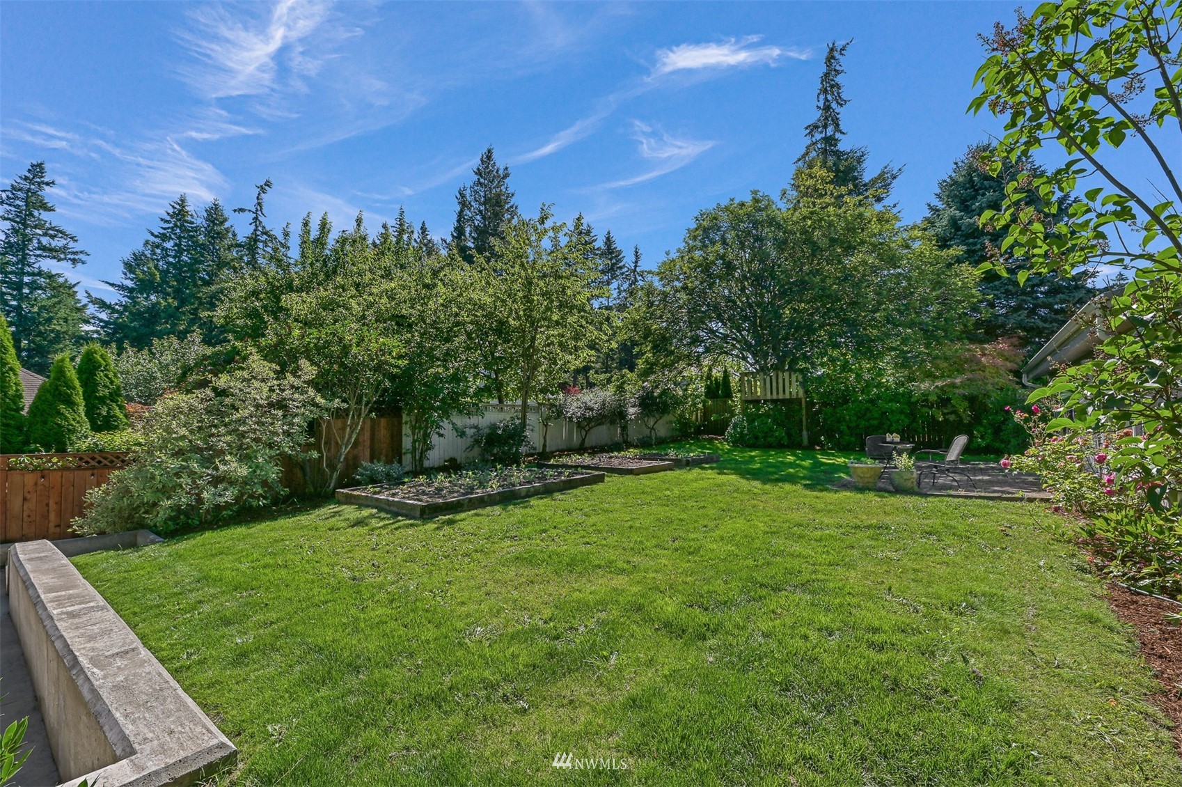 622 Everglade Road Bellingham, WA 98225 - Photo 27 of 38 a view of a backyard with a garden