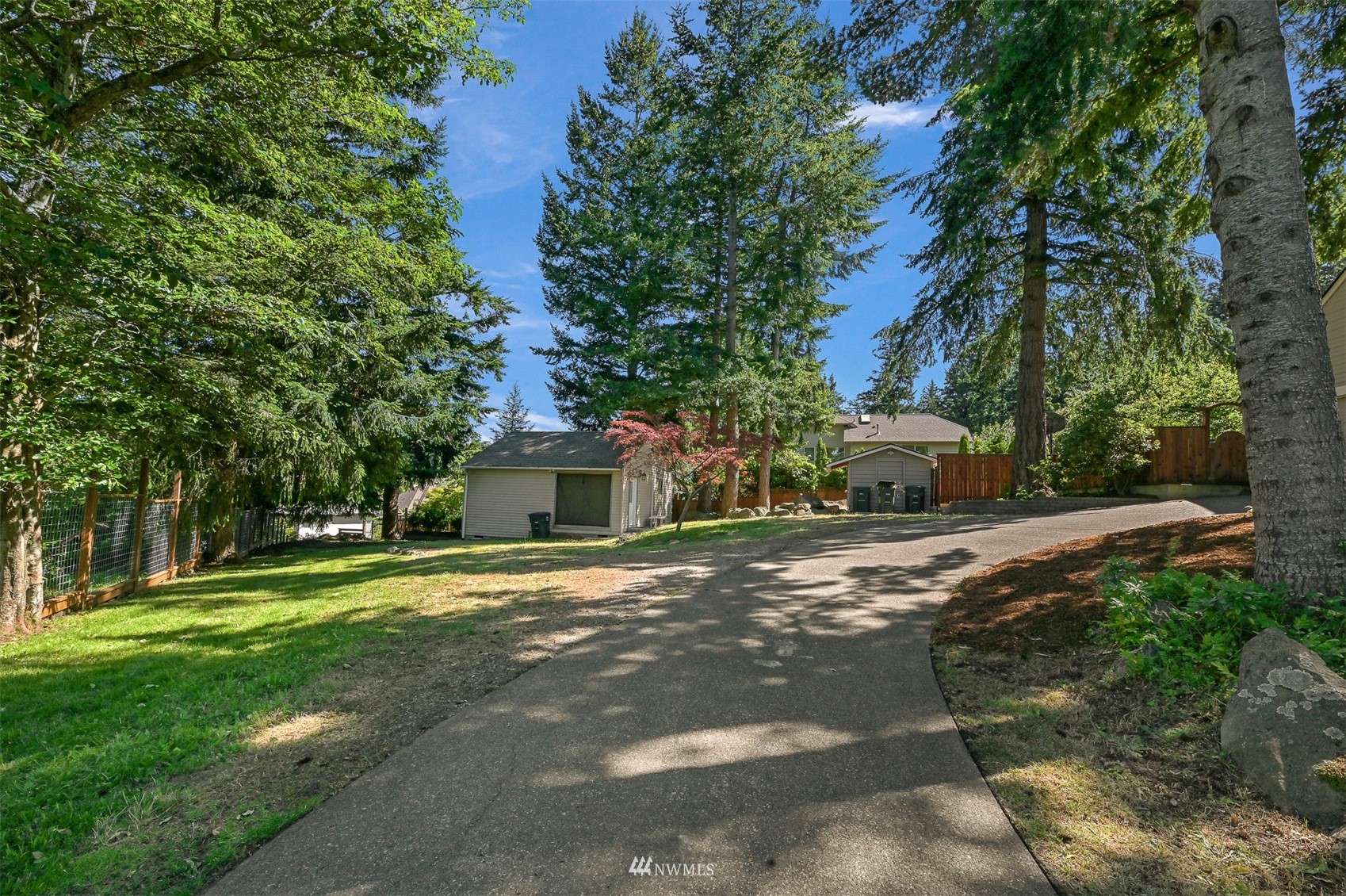 622 Everglade Road Bellingham, WA 98225 - Photo 33 of 38 a front view of a house with a yard and trees