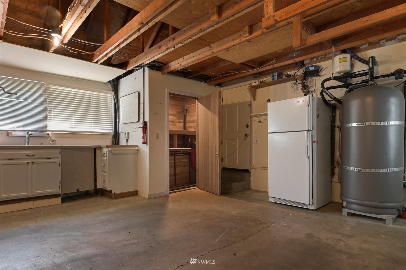 622 Everglade Road Bellingham, WA 98225 - Photo 37 of 38 a view of a refrigerator and window in a room